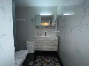 a bathroom with a sink and a toilet in it at KORONI MARE FRONT HARBOR in Koroni