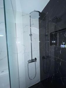 a shower in a bathroom with a glass wall at KORONI MARE FRONT HARBOR in Koroni +23 photos