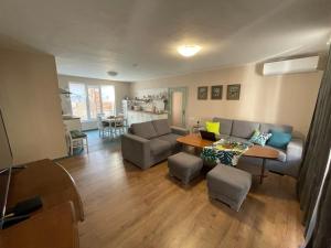 a living room with a couch and a table at NiDo Cozy 3BR Apartment Kapana Top Center in Plovdiv +45 photos