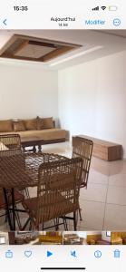 a picture of a dining room with chairs and a table at Appartement meublé à kenitra in Kenitra