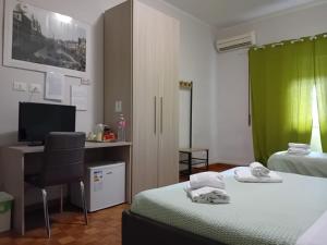 Posteľ alebo postele v izbe v ubytovaní Olimpica Relais guest house