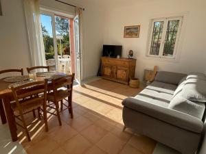 a living room with a couch and a table at Ô Coeur Des Ocres in Roussillon