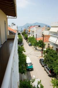 a view from a balcony of a street with cars at Malamatenia Studios in Loutra Edipsou