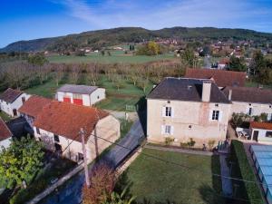 an aerial view of an old house in a village at Maison du Pont de la Roussie in CazoulÃ¨s