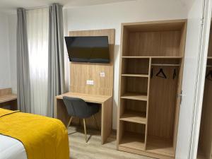 TV a/nebo společenská místnost v ubytování Hôtel NOROTEL