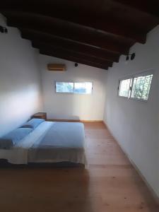 Ένα ή περισσότερα κρεβάτια σε δωμάτιο στο Casa Ágape