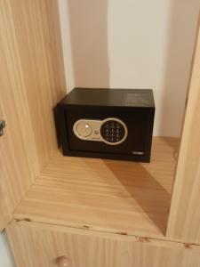 a microwave oven sitting inside of a wooden drawer at "Village Aris" Sevasti Symi Studios in Symi