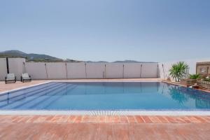 a swimming pool on the roof of a house at 7 bedrooms villa with private pool jacuzzi and wifi at Granada in La Zubia