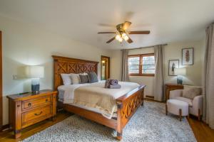 a bedroom with a bed and a ceiling fan at Pet-Friendly Retreat~$375 Free Activities Daily in Hendersonville