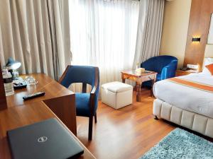 Letto o letti in una camera di Kumari Boutique Hotel