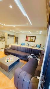 a large living room with couches and a table at Luxury in Tétouan