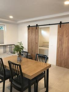 a dining room with a wooden table and chairs at Bella Vista apartment 2 in Izola