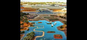 an aerial view of a water park with boats in it at VISION HOTEL Brasilia Piscina Academia Garagem Flat 12 Andar in Brasília