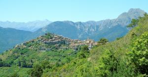 a village on a hill with mountains in the background at Baghe Nove - Bajardo in Baiardo