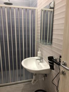 a bathroom with a sink and a mirror at Casa kirò in Naples