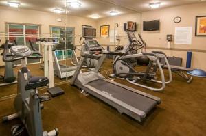 a gym with several exercise bikes and treadmills at Holiday Inn Hotel & Suites Slidell, an IHG Hotel in Slidell
