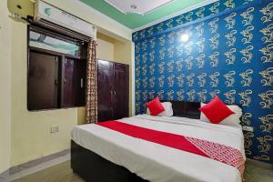 מיטה או מיטות בחדר ב-Flagship Baba Guest House