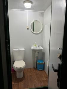 a small bathroom with a toilet and a sink at O Cabaleiro in Santa Marta de Ortigueira +61 photos