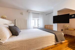 Postel nebo postele na pokoji v ubytování Cesarotti B&B