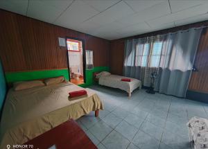 Postel nebo postele na pokoji v ubytování Hotel Gaviotas de Osa