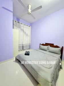 Ένα ή περισσότερα κρεβάτια σε δωμάτιο στο AF Homestay Gong Badak - Unisza, UMT +22 φωτογραφίες