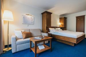 Postel nebo postele na pokoji v ubytování Hotel Reindl Suiten & Appartments