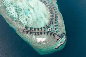 an aerial view of an island in the ocean at The St. Regis Maldives Vommuli Resort in Dhaalu Atoll
