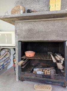 a oven with a pot and utensils in it at Villa stamalmar in Villaricos