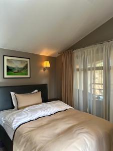 Un pat sau paturi într-o cameră la ANCA RESORT & SPA - Transilvania