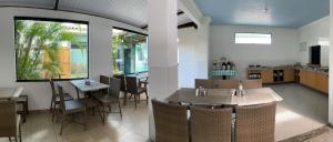 a restaurant with a table and chairs in a room at Pousada Santa Fé in Aracaju
