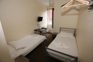 Postel nebo postele na pokoji v ubytování Charlie Hotel