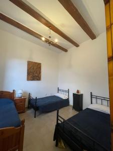 מיטה או מיטות בחדר ב-La Muntanya alojamiento rural turistico vacacional