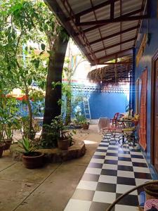 a room with a black and white checkered floor at The Hideout in Kampot