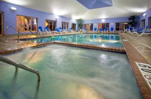a large indoor swimming pool in a hotel room at Holiday Inn Express Hotel & Suites Pleasant Prairie-Kenosha, an IHG Hotel in Pleasant Prairie