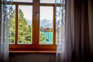 a window with a view of a mountain at Apartament 33 Poronin in Poronin