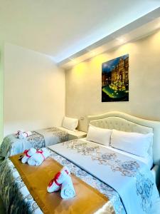 A bed or beds in a room at Santa Maria Accommodation