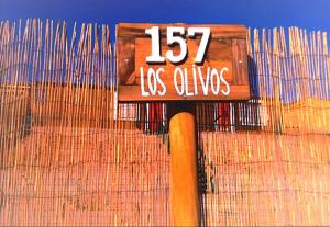 a sign that reads las olivias on a building at Taffy's House in San Pedro de Atacama