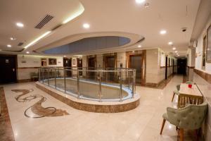 a large room with a large aquarium in a building at فندق مزايا in Az Zāhir
