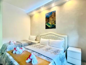 A bed or beds in a room at Santa Maria Accommodation