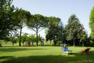 a park with a blue chair and a playground at Casale del fattore in Cesena