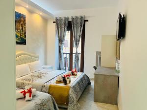 A bed or beds in a room at Santa Maria Accommodation