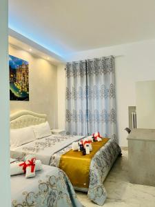 A bed or beds in a room at Santa Maria Accommodation