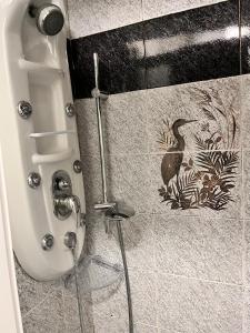 a shower stall with a toilet in a bathroom at Seal Home in Genova
