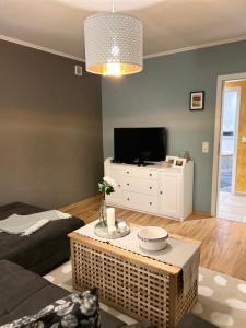 a living room with a couch and a coffee table at Ferienwohnung Saargauliebe in Saarburg