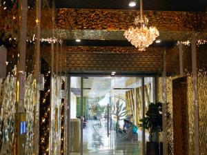 a store front with a chandelier and a window at Copacabana Jomtien Luxury Residence & Yahaha in Jomtien Beach