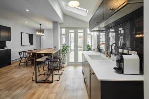 a kitchen with a table and a dining room at Ocean View in Hornsea