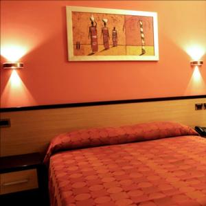 Cama o camas de una habitación en Hotel Cristina