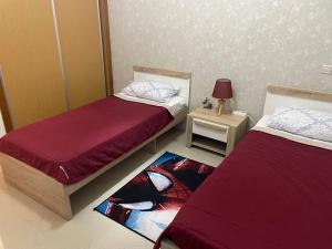 Ένα ή περισσότερα κρεβάτια σε δωμάτιο στο Asilah Marina Golf Appart Rez de Jardin Vue sur Mer