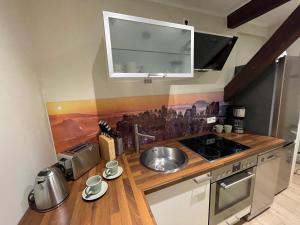 Kuchyň nebo kuchyňský kout v ubytování Ferienwohnung Kohlbornsteinblick am Malerweg + 2 fotografie