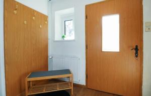 a room with a wooden door and a window at Ferienwohnung In Irschen in Irschen